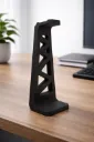 Geometric black headphone stand on desk.webp